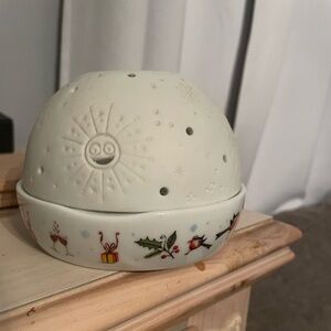 Ceramic votive candle holder.